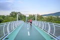 Bicycle riders riding on bicycle bridge called Ã¢â¬ÅFreedom bridgeÃ¢â¬Â connecting two countries Slovakia and Austria Bratislava,